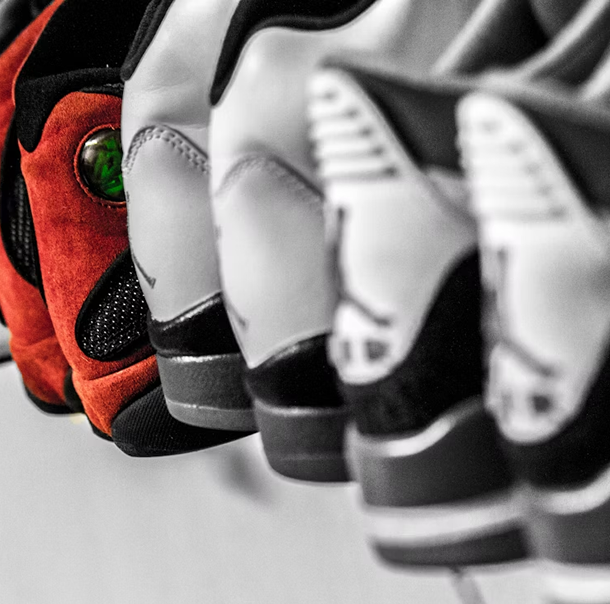 A row of shoes of different styles and sizes